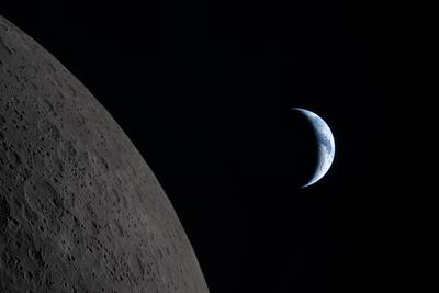 Crescent Earth rising beyond the Moon limb